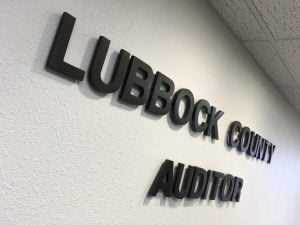 Where was County Auditor Jackie Latham?
